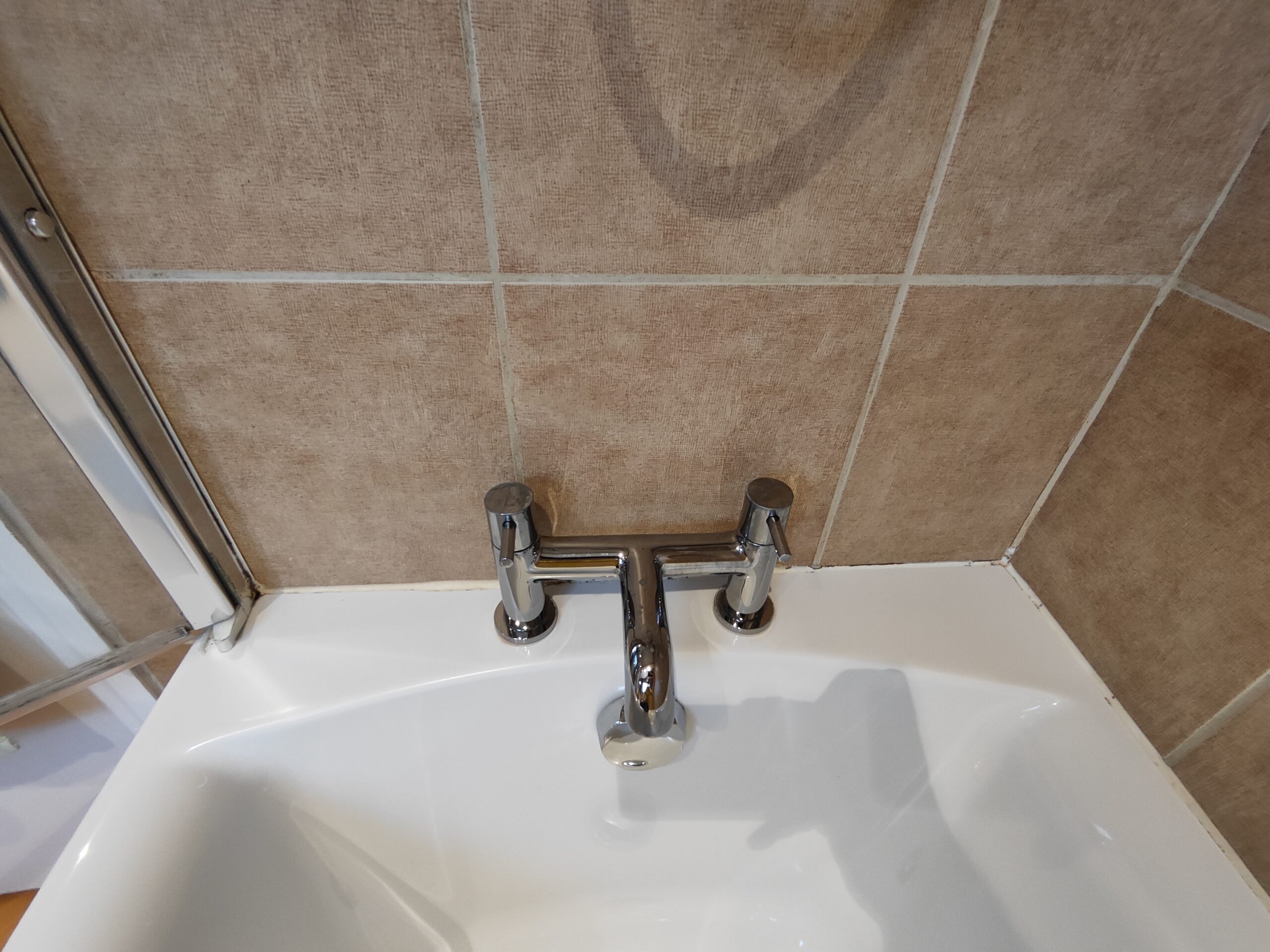 before replacement of silicon (sealant) in bathroom